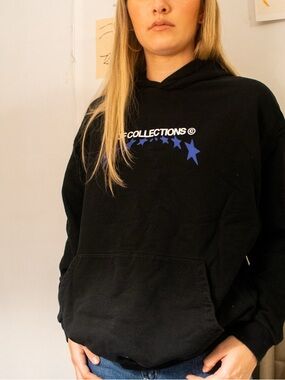 Black ASOS streetwear hoodie with white and blue y2k details.
